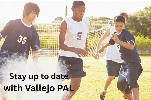 boys playing soccer on the field